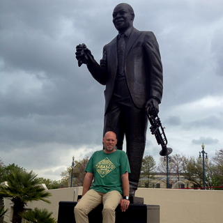 patrick and the statue of louis armstrong, new orleans (iphone)